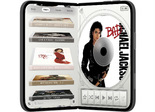 iPhone Duo partly open, albums beside the disc.